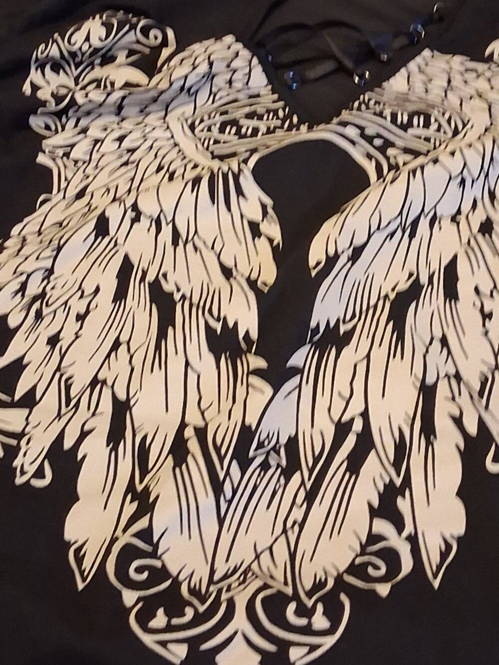 womans black plus shirt with angel wings.